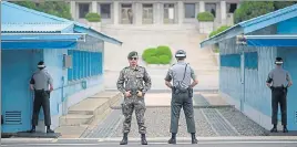  ?? AFP ?? South Korea’s soldiers guard the military demarcatio­n line separating it from the North.