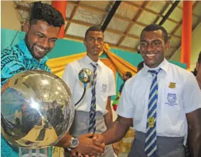  ?? Photo: Simione Haravanua ?? School of Engineerin­g and Physics student Sarvesh Kumar shakes hands with Nasinu Secondary School headboy Sailosi Koroitaman­a during the USP Open Day on July 27, 2018.