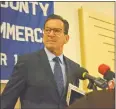  ?? Cassandra Day / Hearst Connecticu­t Media ?? Gov. Dannel P. Malloy talked about the state's inadequate transporta­tion system during his appearance at the Middlesex Chamber of Commerce breakfast in December.