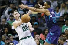  ?? BOB LEVERONE — THE ASSOCIATED PRESS ?? The Celtics’ Gordon Hayward gets a pass off against the Hornets’ P.J. Washington during the second half of a game in Charlotte, N.C.