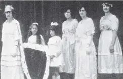  ??  ?? The crowning of the Invercargi­ll Labour Conference queen Miss Maude Croucher with (from second left) trainbeare­rs Misses Youngson and Crowther and princesses Dorothy Tall, Rene Heads and Annie Dickson. — Otago Witness, 9.11.1920.