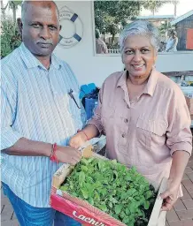  ?? | DUNCAN GUY ?? ANY old container can be used to grow seedlings, say Johnny and Devi Munien of Asherville, who want people to become food self-sufficient.