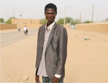  ?? (Joe Penn/Reuters) ?? MAYANGO JALLAH poses in Agadez, Niger, in May: ‘I want to go to school, earn a Masters... [If] I have a European degree I can work anywhere.’