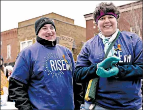  ?? SARAH FERRARO/POST-TRIBUNE ?? Collin Czilli and Kate Sanders handed out informatio­n about early voting as part of Rise NWI at a March for our Lives event in March 2018 in Valparaiso. Rise NWI was founded in 2017.