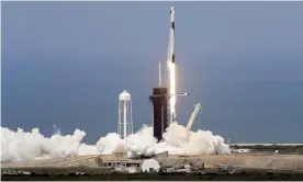  ?? Photograph: Chris O’Meara/AP ?? A SpaceX Falcon 9, with Nasa astronauts Doug Hurley and Bob Behnken in the Dragon crew capsule, lifts off from Pad 39-A at the Kennedy Space Center in Cape Canaveral, Florida.