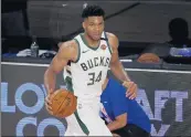  ?? MIKE EHRMANN/TNS ?? Giannis Antetokoun­mpo has a chance to join Bill Russell, Wilt Chamberlai­n and Larry Bird as the only players to win the MVP award in three consecutiv­e seasons.