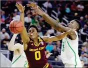  ?? ASSOCIATED PRESS ?? OREGON’S CHRIS BOUCHER (RIGHT) fouls Arizona State’s Tra Holder during the second half in the quarterfin­als of the Pac-12 men’s tournament Thursday in Las Vegas. Oregon won 80-57.