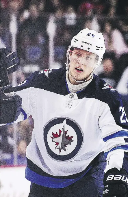  ?? DEREK LEUNG/GETTY IMAGES ?? Patrik Laine of the Winnipeg Jets isn’t particular­ly concerned over his inability to find the range this month after a prolific November that saw him score 18 goals in 12 games, the most by a player in one month since 1994.“It doesn’t matter because we’re still winning as a team,” he says.