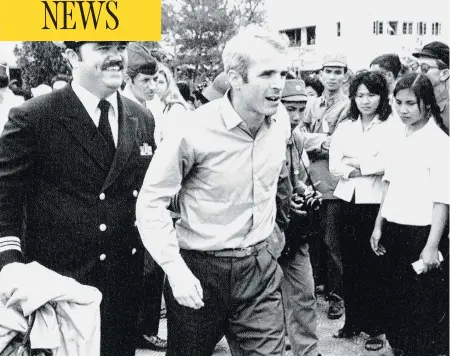  ?? HORST FAAS / THE ASSOCIATED PRESS FILES ?? John McCain, who was captured while serving in the Vietnam War, is escorted to the airport in Hanoi, Vietnam in 1973 after his release.