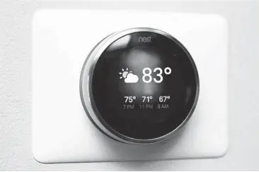  ?? TYLER LIZENBY/CNET ?? The Nest Learning Thermostat’s third generation has a larger screen and a slimmer profile.