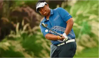  ??  ?? On to Augusta: Kiradech Aphibarnra­t of Thailand playing a shot during the third round of the Indonesian Masters in Jakarta on Saturday. He has earned a place in the US Masters based on a world rankings projection.