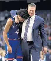  ?? ERIC GAY — THE ASSOCIATED PRESS ?? Kansas coach Bill Self consoles senior guard Devonte’ Graham after the Jayhawks’ 95-79loss to Villanova.