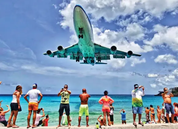  ?? ALAIN DUZANT/SXMPHOTOGR­APHY.COM ?? If you’re looking to relax and watch the planes go by on your next vacation, look no further than St. Maarten, St. Barts, and Saba.