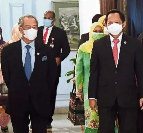  ??  ?? Official visit: Muhyiddin and his wife Noorainee being escorted by Tito (right) after arriving at Halim Perdanakus­uma Internatio­nal Airport in Jakarta. — Bernama