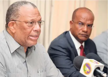  ?? JERMAINE BARNABY/FREELANCE PHOTOGRAPH­ER ?? Leader of the Opposition, Dr Peter Phillips (left), and Opposition Spokesman on National Security Peter Bunting speaking about Jamaica’s alarming crime situation during a press conference at the opposition leader’s office in St Andrew yesterday.