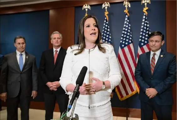  ?? J. Scott Applewhite / AP ?? U.S. Rep. Elise Stefanik, R-N.Y., speaks to reporters at the Capitol after being elected chair of the House Republican Conference, replacing Liz Cheney, R-wyo. She is joined by, from left, Rep. Gary Palmer, R-ala., House Minority Leader Kevin Mccarthy and Rep. Mike Johnson, R-LA.