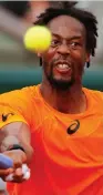  ?? (Reuters) ?? GAEL MONFILS returns the ball to Brazil’s Thiago during the Frenchman’s 6-1, 6-4, 6-1 second-round victory yesterday at Roland Garros.