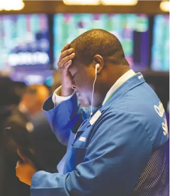  ?? MARK LENNIHAN / THE ASSOCIATED PRESS ?? Trader Thomas Lee works at the New York Stock Exchange on Friday as stocks opened higher on Wall Street a day after the worst drop since 1987. This is when it gets tricky for investors, Tom Bradley writes.