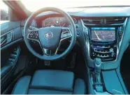  ??  ?? The 2014 Cadillac CTS’s interior is dragged down by problemati­c haptic buttons and the unfriendly Cadillac User Experience multimedia system.