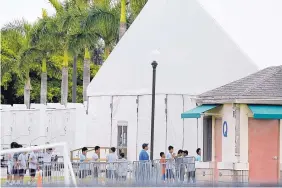  ?? BRYNN ANDERSON/ASSOCIATED PRESS ?? Immigrant children walk in a line outside the Homestead Temporary Shelter for Unaccompan­ied Children in Homestead, Fla., in June.