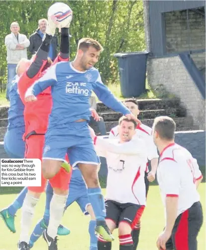  ??  ?? Goalscorer­There was no way through for Kris Gebbie from this cross but his two free kicks would earn Lang a point