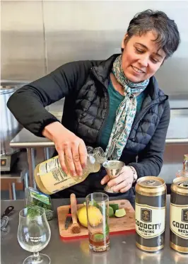  ??  ?? Mary Pellettier­i adds lemonade to her beer version of the mojito, which also contains a ginger beer concentrat­e.