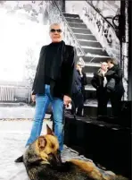 ?? ?? Italian designer Roberto Cavalli poses with his dog prior to the Just Cavalli Fall-winter 20122013 collection on February 24, 2012.