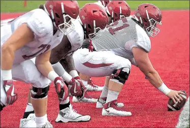  ?? NWA Democrat-Gazette/J.T. WAMPLER ?? Hjalte Froholdt, shown at center during practice earlier this month, Johnny Gibson and Brian Wallace are the three returning starters on Arkansas’ offensive line. Froholdt, who was moved to center during preseason workouts, has 25 career starts, all at left guard.