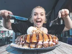  ??  ?? Brooklyn Armstrong tries the Harlem Hatchet pancake from Gangster and Gatsby.