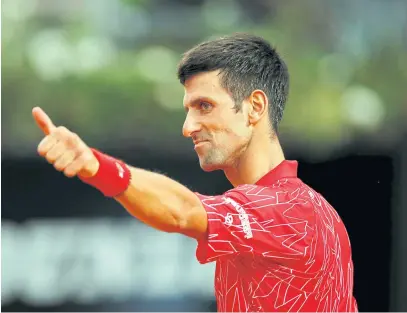  ??  ?? EYEING 18TH SLAM: Novak Djokovic reacts during the Italian Open final against Diego Schwartzma­n.
