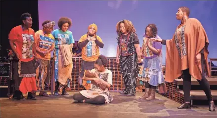  ?? PLEVIN ?? Camara Stampley (seated) holds the baby Jesus during the 2017 production of “Black Nativity” at the Marcus Center.