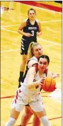  ?? MARK HUMPHREY ENTERPRISE-LEADER ?? Farmington junior Morgan Brye hangs onto a defensive rebound with Gentry’s 6-0 Emily Toland crashing the offensive glass. Farmington didn’t play its best game, yet held off the Lady Pioneers during a Tuesday, Feb. 9 girls basketball, 46-32, win at Cardinal Arena.