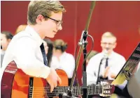  ??  ?? Strum performanc­e Elliot Lawrence, S6 gave a solo