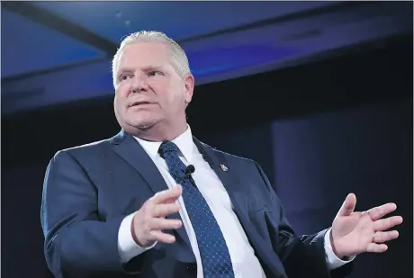  ?? THE CANADIAN PRESS/JUSTIN TANG ?? Ontario PC Party leadership candidate Doug Ford participat­es in a question-and-answer session at the Manning Networking Conference in Ottawa on Saturday. He, along with the other main contenders, say they would scrap plans for a carbon tax.