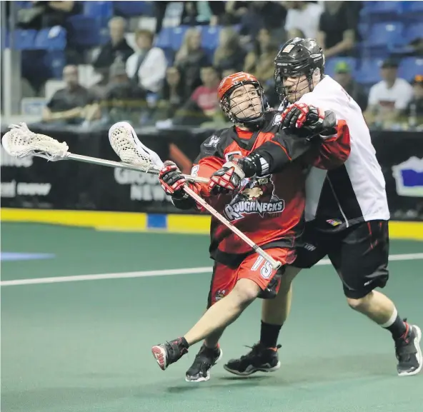  ?? KIM STALLKNECH­T/PNG ?? Curtis Hodgson, right, made a lacrosse career out of shutting down players like Shawn Evans of the Calgary Roughnecks. The Vancouver Stealth will make his the first National Lacrosse League jersey to hang from the Langley Events Centre rafters.