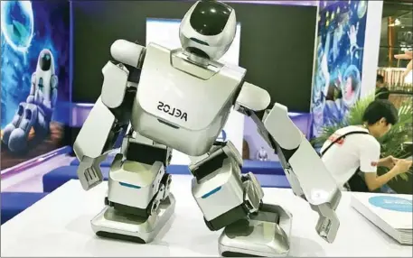  ?? THE NATION ?? A robot is displayed at CES Asia 2018 in Shanghai.