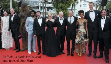  ?? PHOTO BY JOEL C RYAN — INVISION — AP ?? Actors Phoebe Waller-Bridge, from left, Paul Bettany, Chewbacca, Donald Glover, Alden Ehrenreich, Emilia Clarke, director Ron Howard, actors Woody Harrelson, Thandie Newton, and Joonas Suotamo pose for photograph­ers upon arrival at the premiere of the film ‘Solo: A Star Wars Story’ at the 71st internatio­nal film festival, Cannes, southern France, Tuesday.