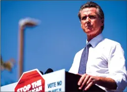  ?? KENT NISHIMURA / LOS ANGELES TIMES ?? Governor Gavin Newsom speaks ahead of Vice President Kamala Harris at a rally against the upcoming gubernator­ial recall election last Wednesday in San Leandro.