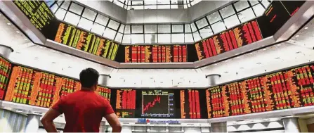  ?? — AP ?? Big gainers: The multinatio­nal corporatio­ns have seen their share prices skyrocketi­ng amid the bearish sentiment of analysts and the generally lacklustre FBM KLCI’s performanc­e.