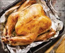  ?? DANIEL J. VAN ACKERE — AMERICA’S TEST KITCHEN VIA AP ?? This undated photo provided by America’s Test Kitchen in October 2018 shows a roast turkey in Brookline, Mass. This recipe appears in the cookbook “ATB Holiday Entertaini­ng.”