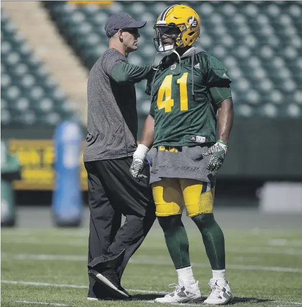  ?? GREG SOUTHAM ?? Head coach Jason Maas makes a point with Odell Willis during Sunday’s first day of training camp for the Edmonton Eskimos.