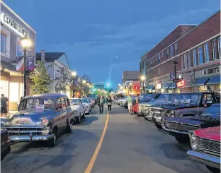  ?? ALEX CLARK/SPECIAL TO THE GUARDIAN ?? The Aug. 23 Classic Car Nights in downtown Summerside had more than 170 cars in the event. People swarmed around classic cars and mingled with automobile enthusiast­s and other attendees.