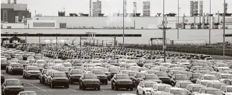  ?? Carlos Osorio / Associated Press ?? The United Auto Workers union agrees with major U.S. automakers’ plans to reopen factories May 18.