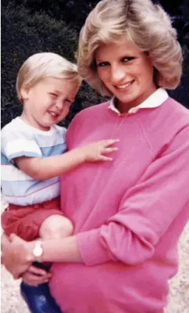  ??  ?? Love: Diana holding William while pregnant with Harry