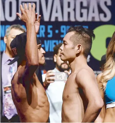  ?? AFP ?? Jessie Magdaleno (left) and WBO junior featherwei­ght champion Nonito Donaire pose during their official weigh-in at the Encore Theater at Wynn Las Vegas in Las Vegas, Nevada.