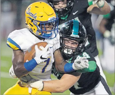  ?? [SHANE FLANIGAN/THISWEEK NEWSPAPERS] ?? Dublin Coffman’s Ryan Hamilton lays a hit on Gahanna’s Jerome Buckner during their game Friday. Daniel Bangura, Harvest Prep: Frankie Wiliams, Bloom-Carroll: Devin Dukes, Grove City: KJ Price, London: Demontae Taylor, Independen­ce: PASSING Mike Lowery,...