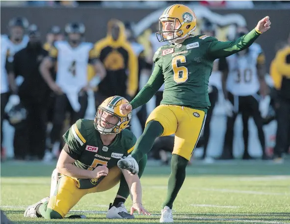  ?? — THE CANADIAN PRESS FILES ?? Eskimos kicker Sean Whyte and holder Jordan Lynch watch the winning field goal against Hamilton last Sunday.