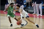  ?? DARRON CUMMINGS - THE ASSOCIATED PRESS ?? Villanova’s Caleb Daniels (14) is defended by North Texas’ JJ Murray (11) during the second half of a second-round game in the NCAA men’s college basketball tournament at Bankers Life Fieldhouse, Sunday, March 21, 2021, in Indianapol­is.