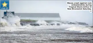  ?? AP ?? Waves crash against rock
embankment­s during Tropical Storm Arthur in New Brunswick Saturday.