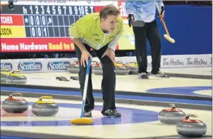  ?? ERIC MCCARTHY/JOURNAL PIONEER ?? Skip Adam Casey intently follows a shot during Thursday’s game against John Morris at the 2017 Home Hardware Road to the Roar Pre-Trials curling event at Eastlink Arena. Casey pulled out a 9-8 victory.